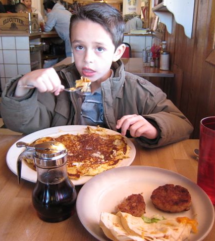 Seven-year-old Stevie Sunday attempts to put a dent on a K&I pancake.