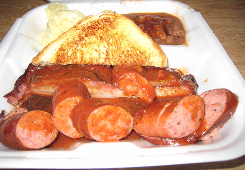 Pork ribs, sausage, Texas toast, potato salad and barbecue beans.