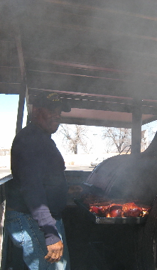 The man himself, Big John tends to his smoker.