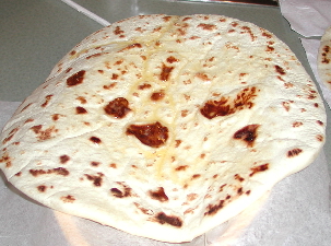 Maybe the very best tortillas in town.  Note the melting butter dripping down the just-off-the-comal tortilla.