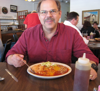 My friend Mike Muller about to dig into a chicken enchilada platter.