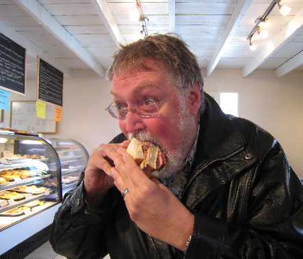 My friend Bill Resnik attepts to bite into the Have your Cake Dagwood sandwich