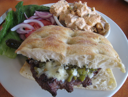 The quintessential burger with green chile and gorgonzola