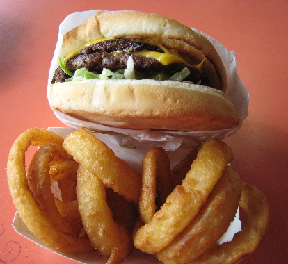 Giant double green chile cheeseburger and onion rings.