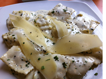  Fresh herbs raviolis topped with a goat cheese cream sauce