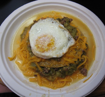 Cheese enchiladas with an egg on top