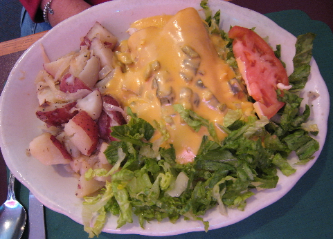 Enchiladas topped with queso