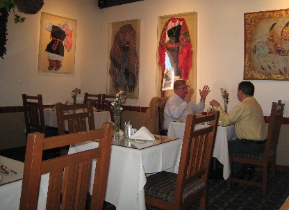 Regalia of Indian women and children are framed on the restaurant's walls.