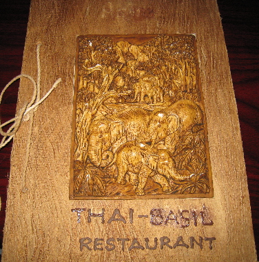 The menu cover features three-dimensional elephants.