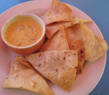 Blue crab claw meat Queso served with tortilla chips