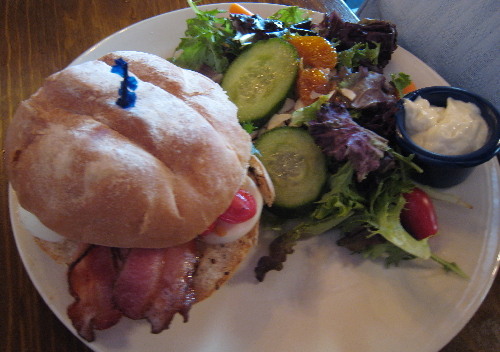 Thick-sliced rashers of Applewood smoked bacon, sliced hard-boiled egg, tomato and mayo on a toasted Telera bun