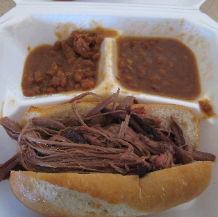 Barbecue brisket sandwich with baked beans