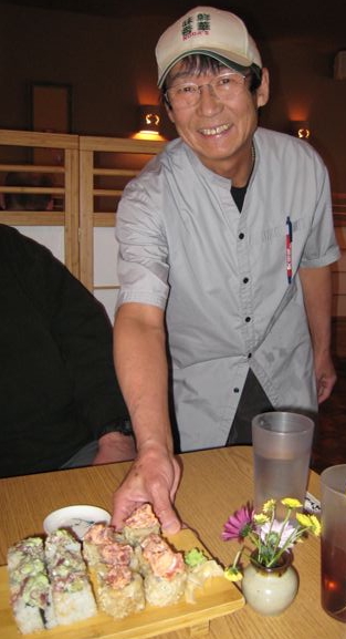 Mr. Noda delivers sushi to our table.