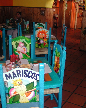 Colorful tables and chairs at Mariscos Costa Azul