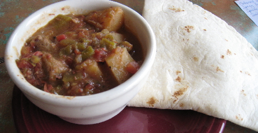 Green chile stew and a tortilla