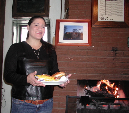 The lovely and talented Mayling Garcia bringing a green chile cheeseburger to our table. We've got the best seat in the house, by the fireplace.