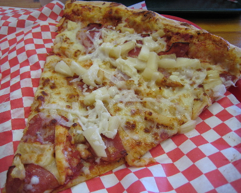 A slice of Hawaiian pizza