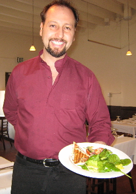 Gino brings a bocadillo to our table