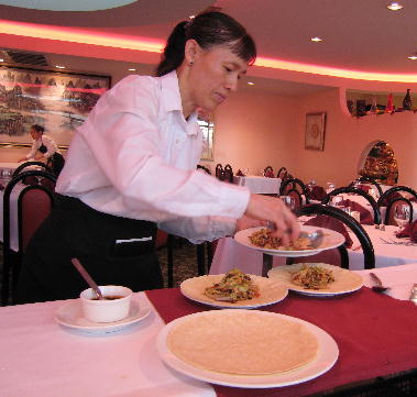 Mousho pork being prepared tableside